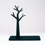 A jewelry stand made of recycled polyester hardened felt in the shape of a tree, designed and made in Japan by Feelt, and on show at NiMi Projects UK.