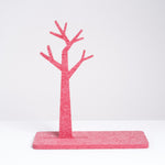 A red trinket stand in the shape of a tree and made of recycled polyester felt, designed by Feelt, made in Japan and available at NiMi Projects UK. 