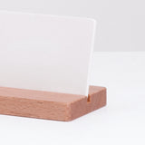 Closeup  of a Ceramic Japan white stone porcelain aroma card diffuser propped on a wooden stand.  Made in Japan and on display at NiMi Projects.,