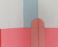 Close up of the centre of Amy Croft's contemporary Japanese noren curtain, showing where the curtains' two panels meet and detailing the design's bojagi hidden seams. The pattern shows the top half of a pale pink slim central oval with a darker pink on either side and a pale blue vertical stripe above. Available at NiMi Projects UK. Image ©Amy Croft.