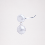 A side view of an Onomatpee Pokopoko 3-pearl stud earring, featuring two larger freshwater pearls, a small pearl in the center, and silver post. Available at NiMi Projects UK.