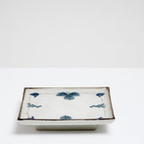 Large square Japanese vintage porcelain dish.  It features a border design of blue underglaze bunches of grapes and vine leaves and a crackle glaze.