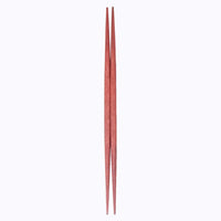 A pair of red ryokuchi (double-end tapered) wooden chopsticks (hashi) made in Japan, on a white background. By Style of Japan and available at NiMi Projects UK.