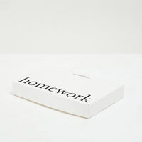 White box containing five eau de parfum samples with 'homework' text on a white background