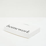 White box containing five eau de parfum samples with 'homework' text on a white background