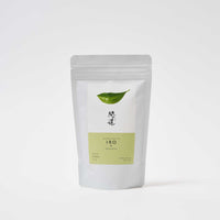 A white pouch of Awaido Japanese green tea leaves. The pouch has a rectangle label with a green illustration of a tea leaf and the name of the tea in Japanese kanji. Below the kanji is a green section of the label with the name in English: Iro. Image ©AWAIDO