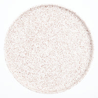 A large, round Kihon no Utsuwa speckled, Japanese porcelain plate. Made in Japan from recycled ceramics and local clays and available at NiMi Projects UK.