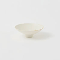 A Kihon no Utsuwa porcelain rice bowl or side dish in creamy white, featuring a small platform base. Made in Japan and available at NiMi Projects UK.