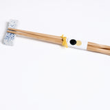 A white and blue speckled Japanese pillow-shaped, Mino-yaki hashioki chopstick rest, with a pair of bamboo chopsticks. On show at NiMi Projects UK.
