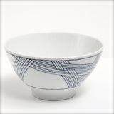 The Ito Tsumugi Japanese white porcelain mino-yaki ramen and noodle bowl, featuring a pattern of criss crossed lines, designed after a Japanese weaving technique. On show at NiMi Projects UK.