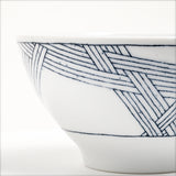 Closeup of a Ito Tsumugi Japanese porcelain mino-yaki ramen and noodle bowl in white, featuring a pattern of criss crossed lines, designed after a Japanese weaving technique. Available at NiMi Projects UK.