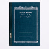 A navy blue Apica note book, showing an arabesque border printed in black with the words "Notebook" and "Most advanced quality Gives best writing features." Its spine is bound in black with a gold CD11 stamp. Made in Japan and available at NiMi Projects UK.