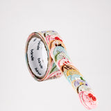 A roll of brightly coloured macaron-shaped Japanese washi paper stickers made by Bande. Each macaron is individually cut and layered slightly on top of the one before to create the strip of stickers. Available at NiMi Projects UK