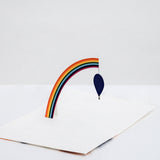 A Chisato Tamabayashi 3D pop-up greeting card featuring a colorful rainbow arch and a dark blue balloon, set against a plain white background. Available at NiMi Projects UK.