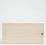 A Hinoki Japanese cypress chopping board with a smooth, pale wood finish, shown from above. Available at NiMi Projects UK.