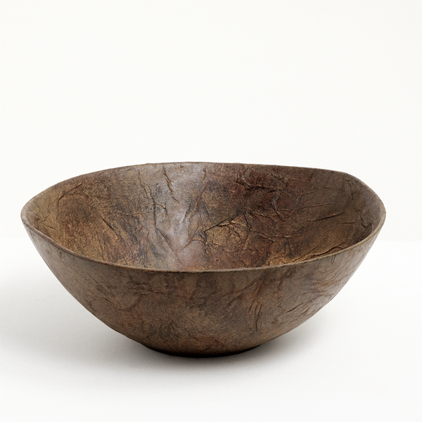 A large lightweight wild cherry wood bowl, hand turned and shaped by Japanese craftsperson Solmu Puut. The wood is sourced from Yakushima thinning projects in Japan and finished with layers of Japanese washi paper and urushi lacquer. On show at NiMi Projects UK.