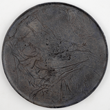 A large circular wild cherry wood plate, textured with layers of washi paper and deep brown lacquer. Hand made by wood artisan Solmu Puut  in Japan from wood sourced from thinning projects in Yakushima. On display at NiMi Projects UK.