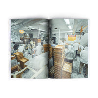A double-page photo spread of the Sankaku Vol. 02: Ramen book of workers in a noodle factory in Japan.