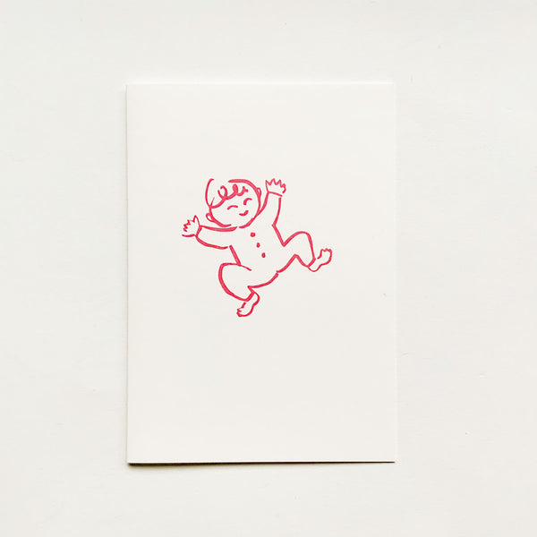 A congratulations card for a new baby, featuring a red line drawing of a smiling baby in a romper suit.