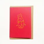 Designed and letter-press printed by Takako Copeland, the Kitty Hug card features parent cat giving a kitten a warm all-embracing hug. A simple yellow line drawing against a vibrant red background that expresses so much.