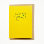  Letterpress printed in green on bright yellow, Takako Copeland's Oxalis Card features an illustration of a bundle of Oxalis growing tall as they are watered by a long-spout watering can.