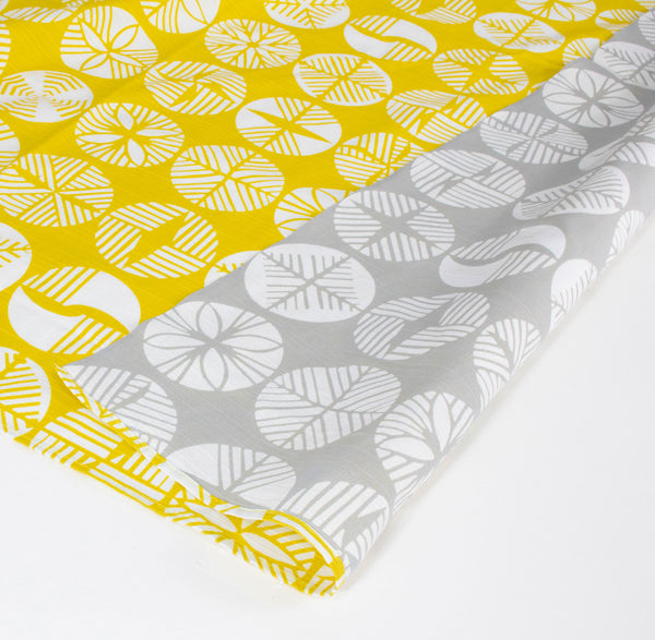 Two-sided Japanese furoshiki gift wrapping cloth with a pattern of circles featuring geometric pine motifs in white, made in Japan, available at NiMi Projects UK