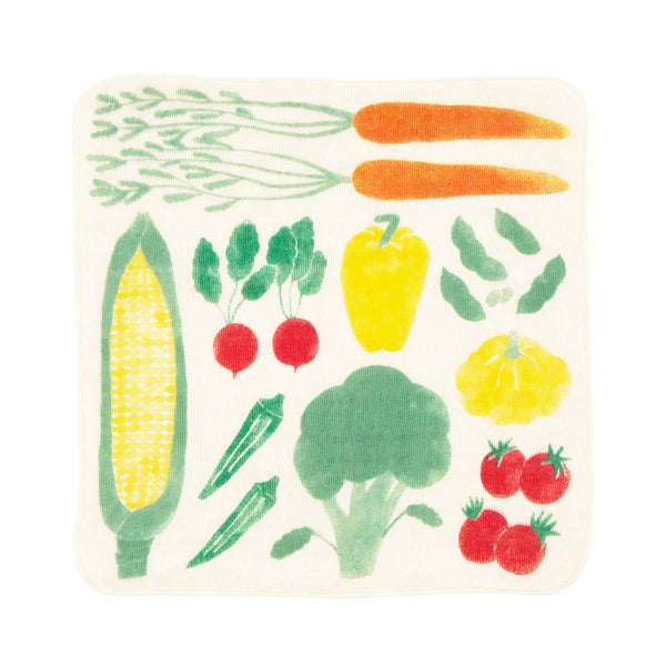 A square organic muslin dishcloth with an illustration of vegetables, designed in Japan by Kayo Aoyama for Musubi and available at NiMi Projects UK.