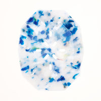 A birds-eye view of a mottled blue and white recycled ocean waste plastic polygon-shaped soap dish, made by Buoy in Japan and available at NiMi Projects UK.