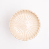 A white Hana Akari Japanese porcelain Mino-yaki chrysanthemum small plate, viewed from above at NiMi Projects Uk.
