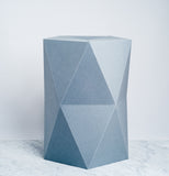 A gray, origami inspired polygonal stool, constructed in card and paper. Designed by Catachi, made in Japan and available at NiMi Projects UK.