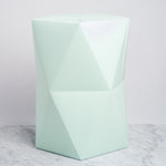 A faceted polygonal stool in mint green, made of card and paper and designed by Catachi. Made in Japan and available at NiMi Projects UK.