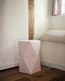 Catachi pink origami inspired polygonal stool, designed and made in Japan, here photographed on location in Devon.