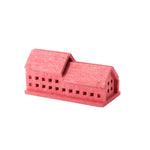 A red house-shaped desk organizer, made in Japan by Feelt and featuring a two pointed roofs and cutout windows.