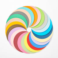 All 24 colors of the Kami no Kousakujo Airvase 24 Colors set of latticed paper circles, fanned out in a circle shape.