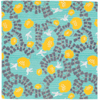 A turquoise furoshiki Japanese wrapping cloth with a pattern of white hummingbirds, bright yellow flowers and swirls of grey leaves, designed by chusen stencil textile dyers in Japan.