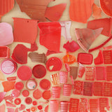 A collection of red marine waste plastic, collected by Buoy in Japan, to be recycled into homeware goods.