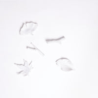 A set of five white porcelain chopstick rests in the shape of leaves and twigs, designed by Kaichiro Yamada for Ceramic Japan. Five shapes inspired by nature feature — a cherry-tree leaf, a ginkgo leaf and a maple leaf, plus two little branches.  All are made in Japan and available at NiMi Projects.