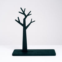 A jewelry stand made of recycled polyester hardened felt in the shape of a tree, designed and made in Japan by Feelt, and on show at NiMi Projects UK.