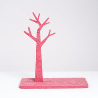 A red trinket stand in the shape of a tree and made of recycled polyester felt, designed by Feelt, made in Japan and available at NiMi Projects UK. 