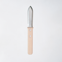NiMi Projects UK's Japanese Asano Mokkousho Hori Hori gardening tool, with a stainless steel serrated-edged mini-trowel end  and a sustainable snow beech wood handle.