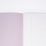 The lilac dotted inside cover of a Japanese notebook available at NiMi Projects UK, (unseen cover is white, featuring polar bear motifs).