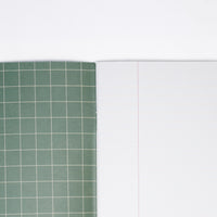  The green window-pane checked inside cover of a Japanese notebook available at NiMi Projects UK, (unseen cover is grey, featuring butterfly motifs).