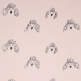 A closeup of a Japanese notebook available at NiMi Projects UK, featuring poodle illustrations on a pink background.