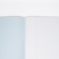 The powder blue striped inside cover of a Japanese notebook available at NiMi Projects UK, (unseen cover is pink, featuring poodle motifs).