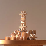 A display of stacked Sukima wood Hositoshi star-shaped building blocks, designed in Japan by Sukima and available at NiMi Projects