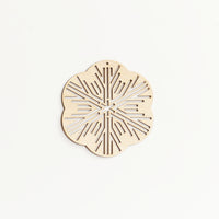 A Sukima Shina wood laser cut snowflake Christmas ornament, made in Japan and sold at NiMi Projects UK 
