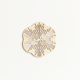 A Sukima Shina wood laser cut snowflake Christmas ornament, made in Japan and sold at NiMi Projects UK 