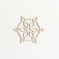 A snowflake shaped Japanese Shina wood laser cut Christmas decoration, made by Sukima and available at NiMi Projects UK