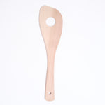 A Japanese magnolia wood spoon-shaped rice paddle, with a hole in its center to aid stirring. Made in Japan and available at NiMi Projects UK.